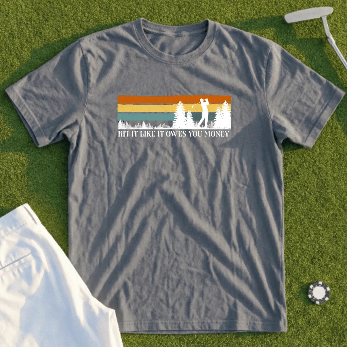 Gray t-shirt with vintage golf sunset graphic and text: "Hit it like it owes you money".