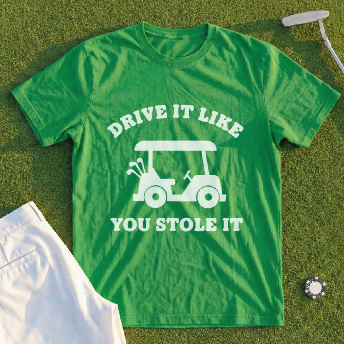 Green t-shirt with white graphic of a golf cart and text "DRIVE IT LIKE YOU STOLE IT".