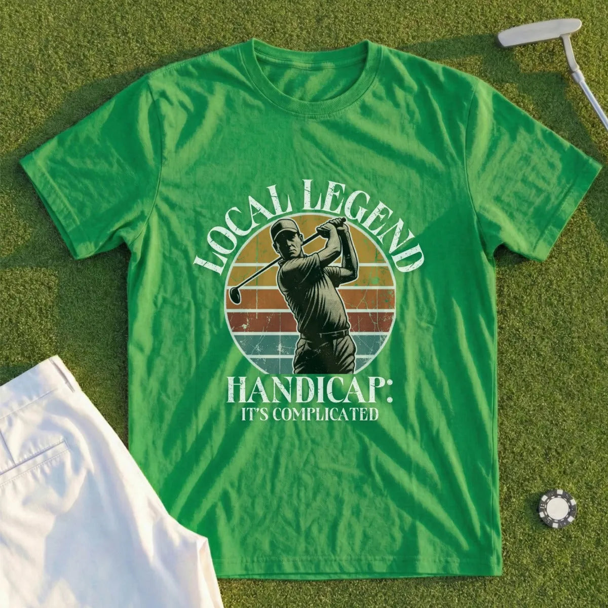 Green t-shirt with "Local Legend: It's Complicated" and golfer illustration.