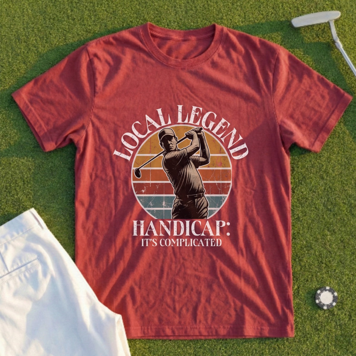 Red t-shirt with golfer graphic and text: "LOCAL LEGEND HANDICAP: IT'S COMPLICATED."