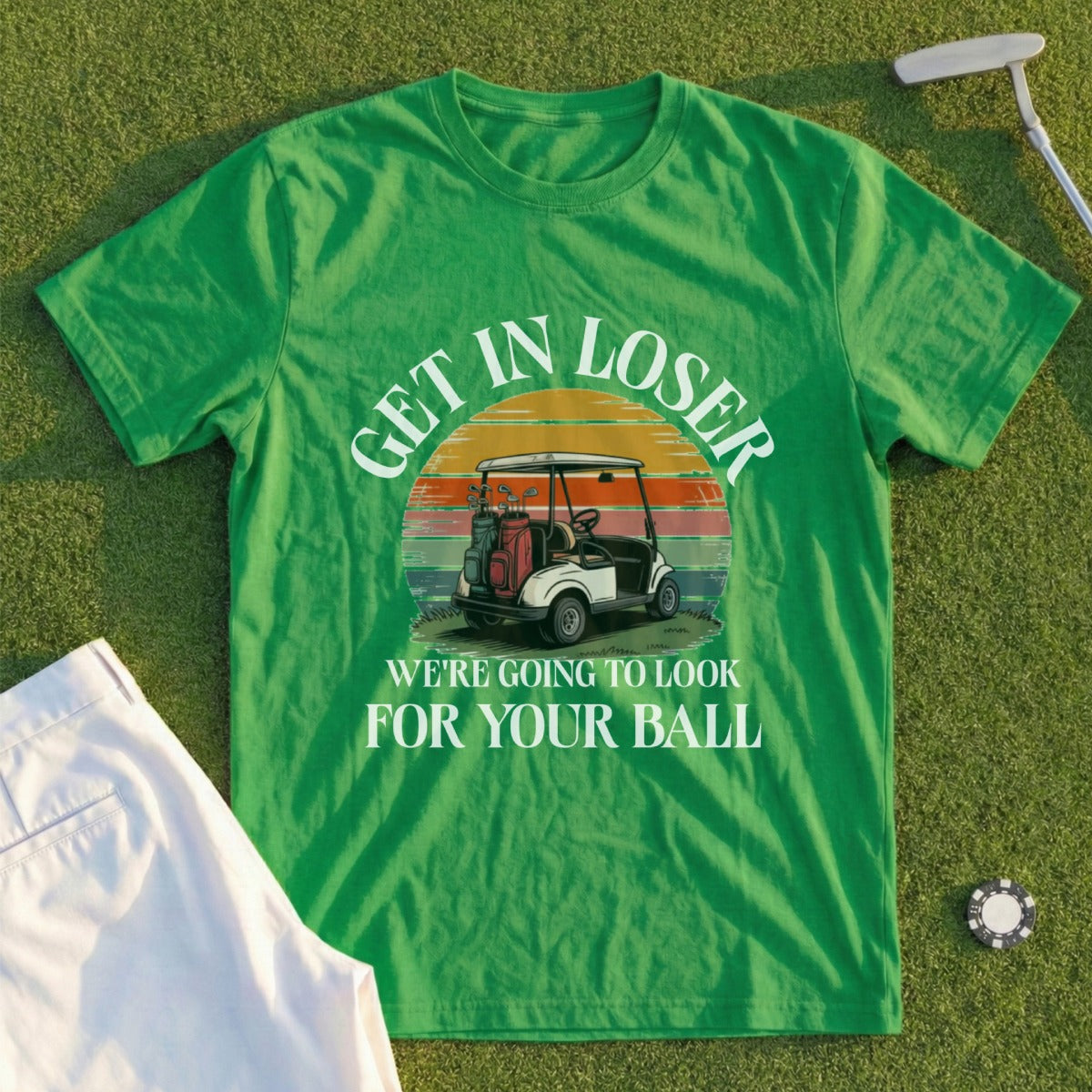 Green t-shirt with golf graphic and "GET IN LOSER WE'RE GOING TO LOOK FOR YOUR BALL" text.