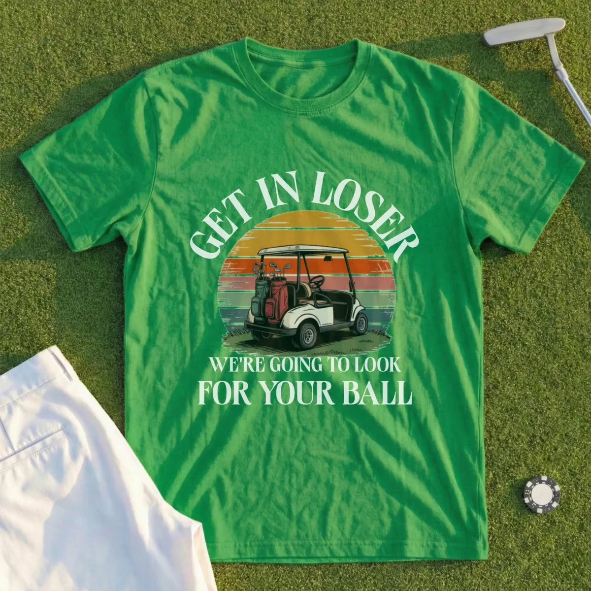 Green t-shirt with golf graphic and "GET IN LOSER WE'RE GOING TO LOOK FOR YOUR BALL" text.