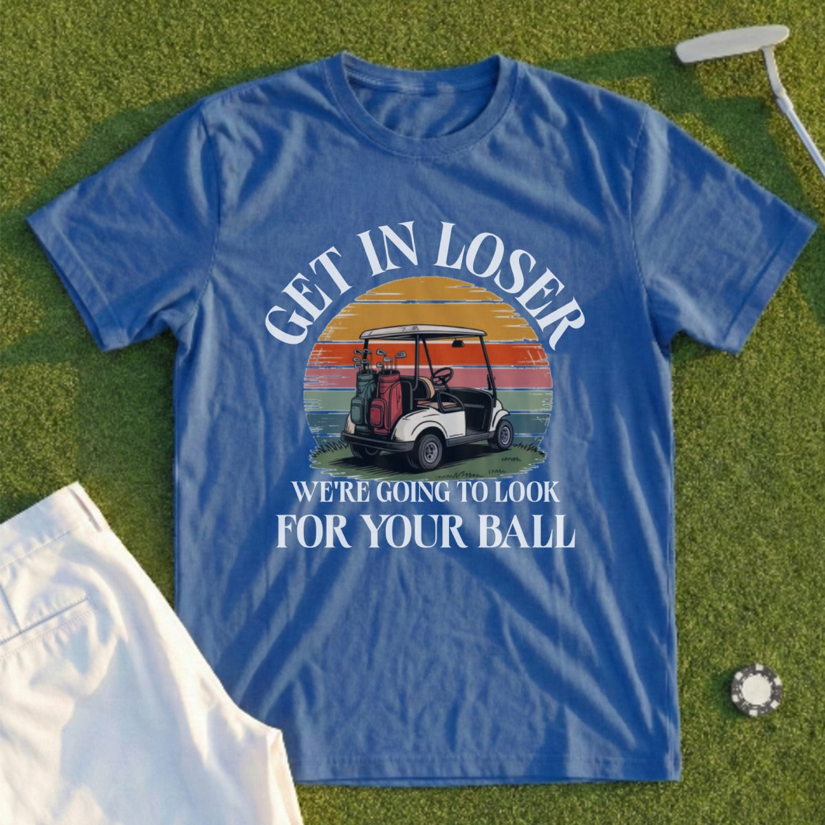 Blue t-shirt with "GET IN LOSER WE'RE GOING TO LOOK FOR YOUR BALL" and golf imagery.