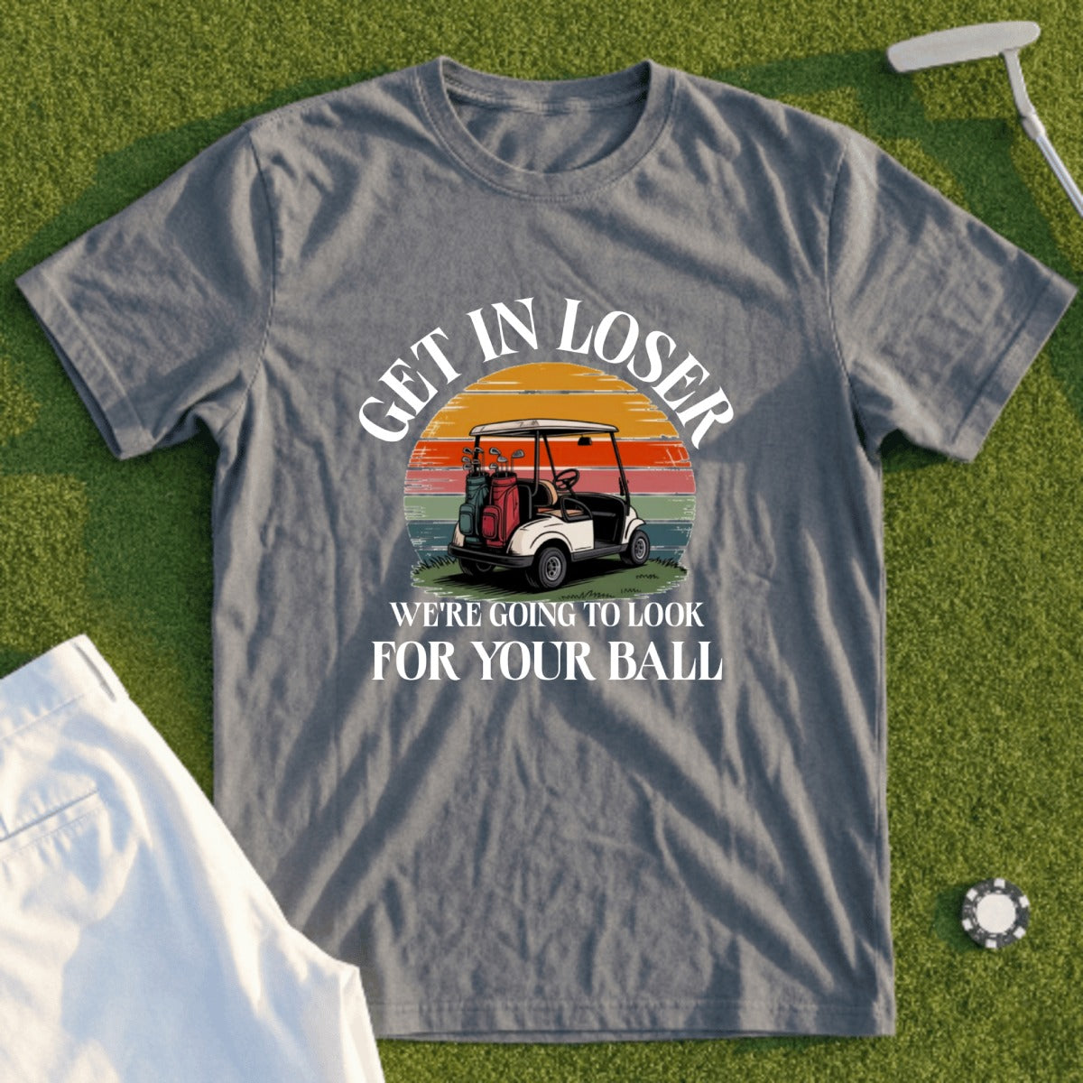 Gray t-shirt with "Get in loser, we're going to look for your ball" text and golf cart graphic.