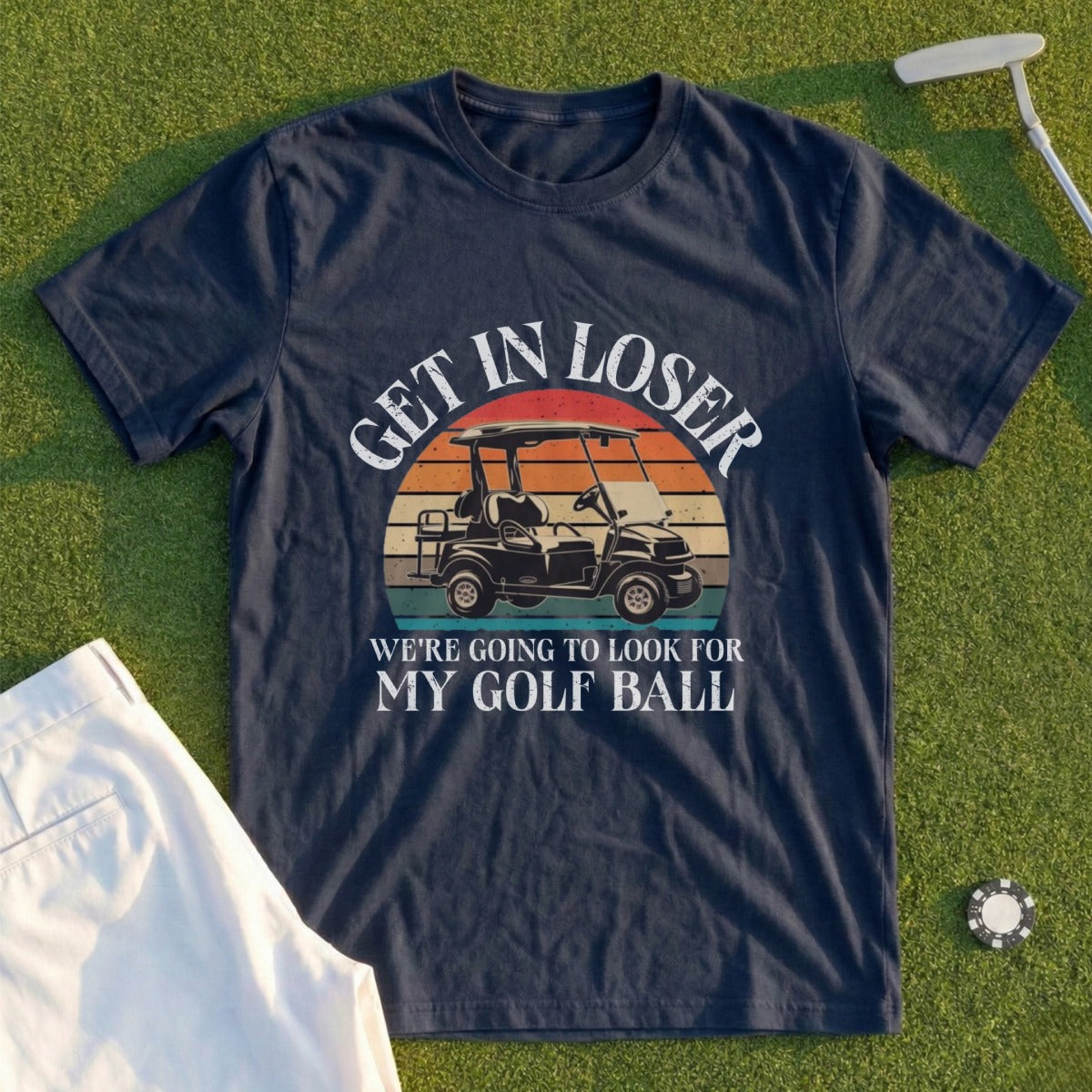Navy t-shirt with "Get in loser, we're going to look for my golf ball" text and golf cart graphic.