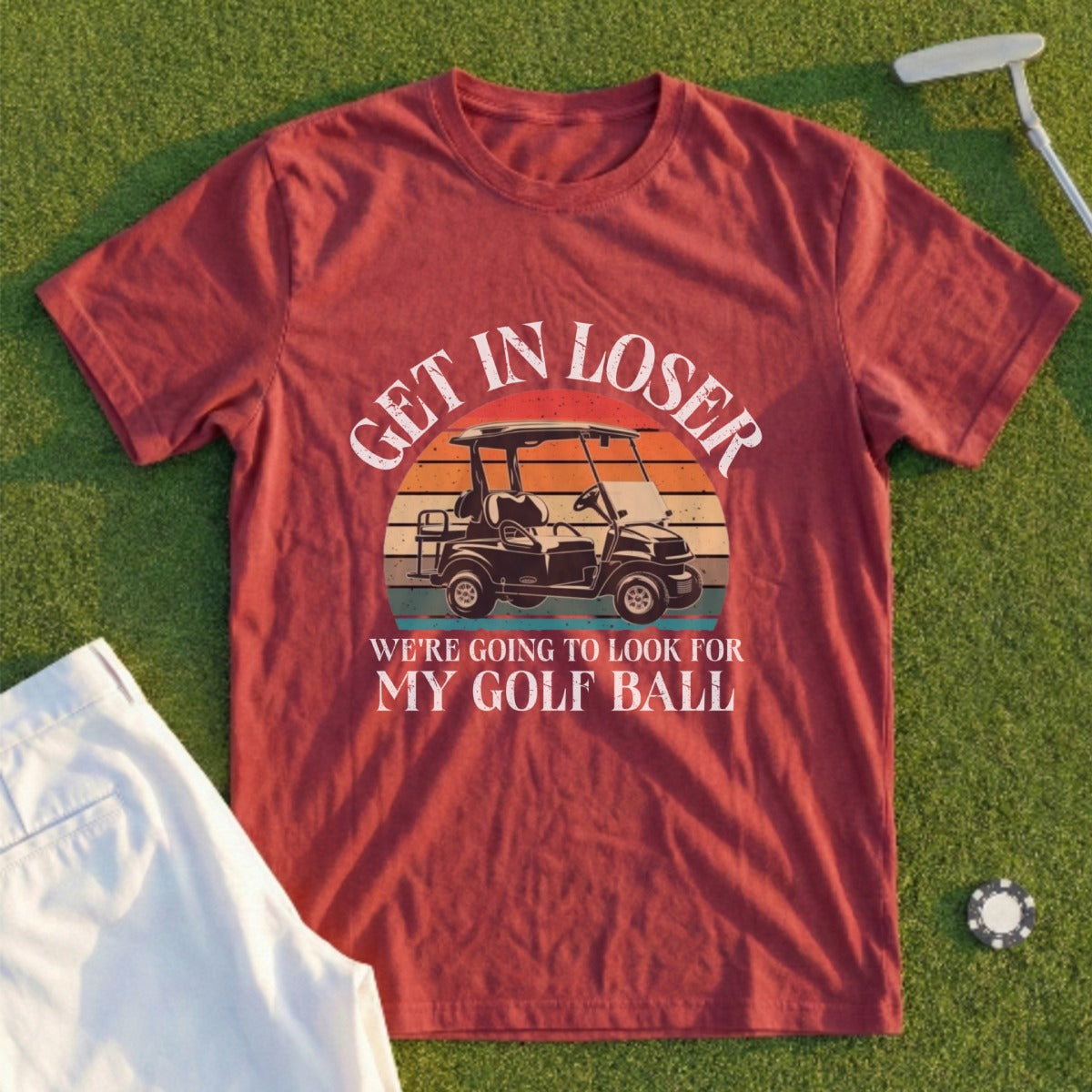 Burgundy t-shirt with "Get in loser we're going to look for my golf ball" text and golf cart graphic.