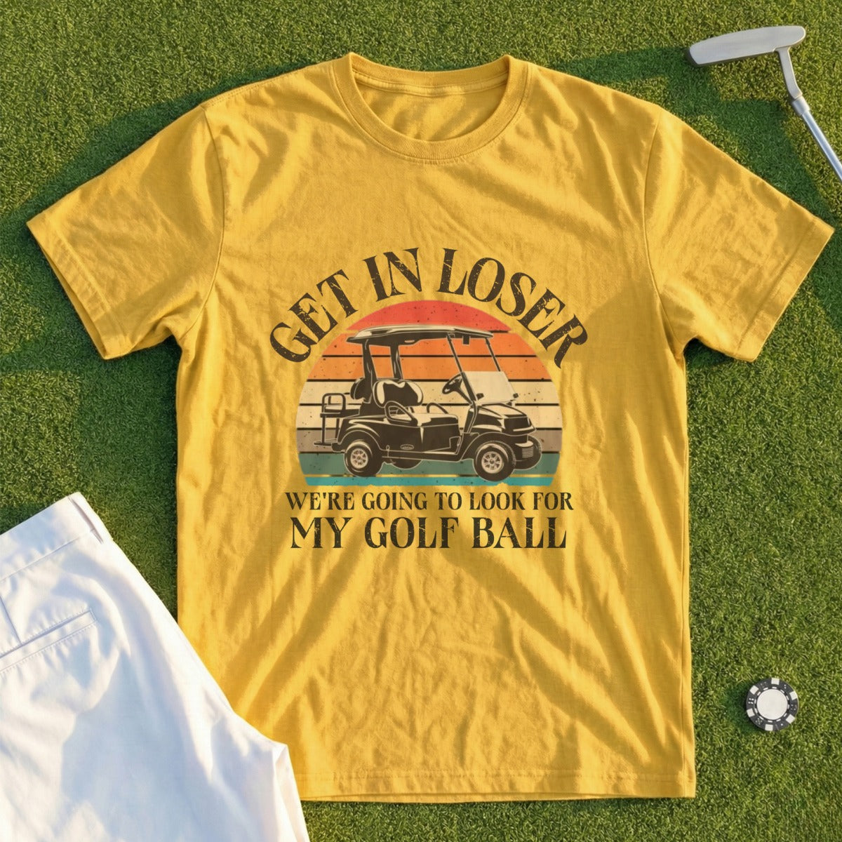 Yellow t-shirt with "Get in loser, we're going to look for my golf ball" text.