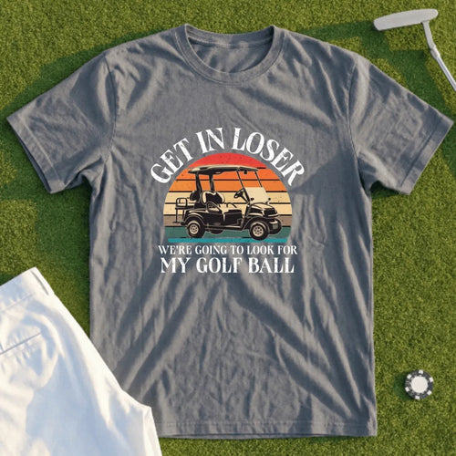 Gray t-shirt with "Get in loser, we're going to look for my golf ball" text and golf cart graphic.