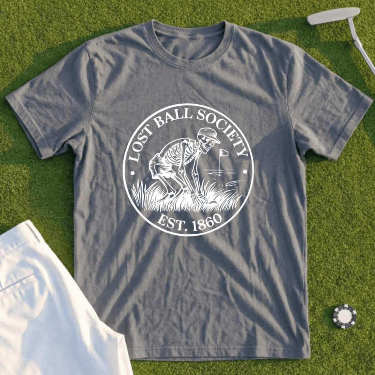 Gray t-shirt with Lost Ball Society logo featuring a skeleton golfing, est. 1860.
