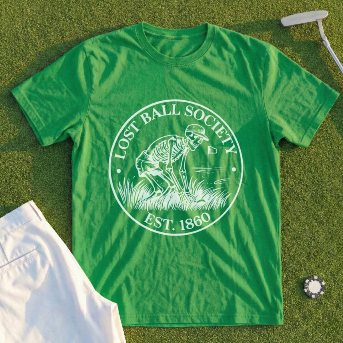 Green t-shirt with circular logo: "Lost Ball Society Est. 1860" skeleton golfer.