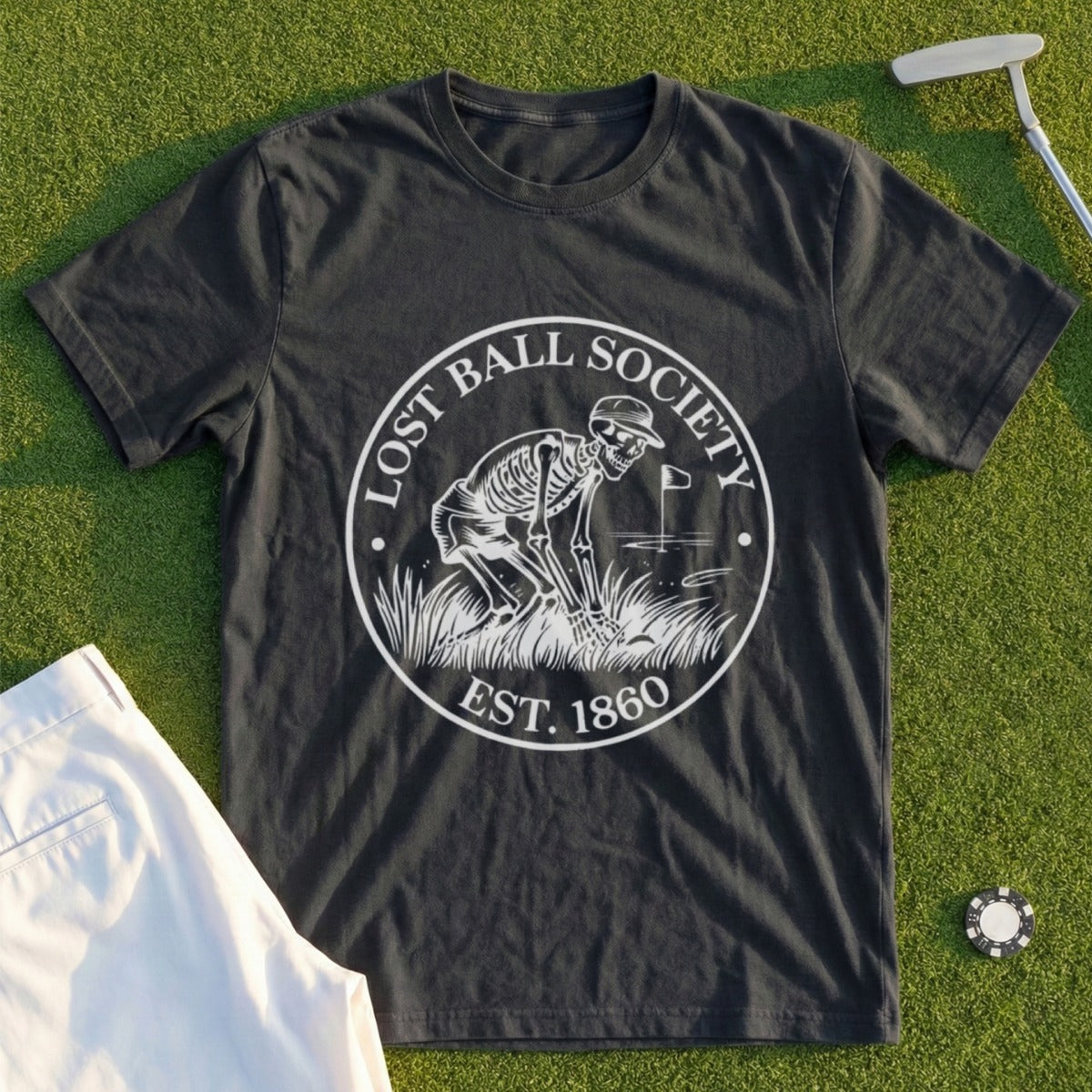 Dark t-shirt with a circular graphic of a skeleton golfing, "Lost Ball Society Est. 1860".