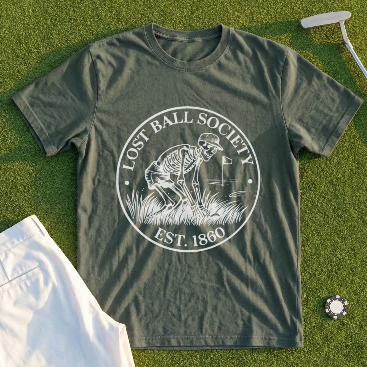 Green t-shirt with "Lost Ball Society Est. 1860" logo featuring a skeleton golfing.