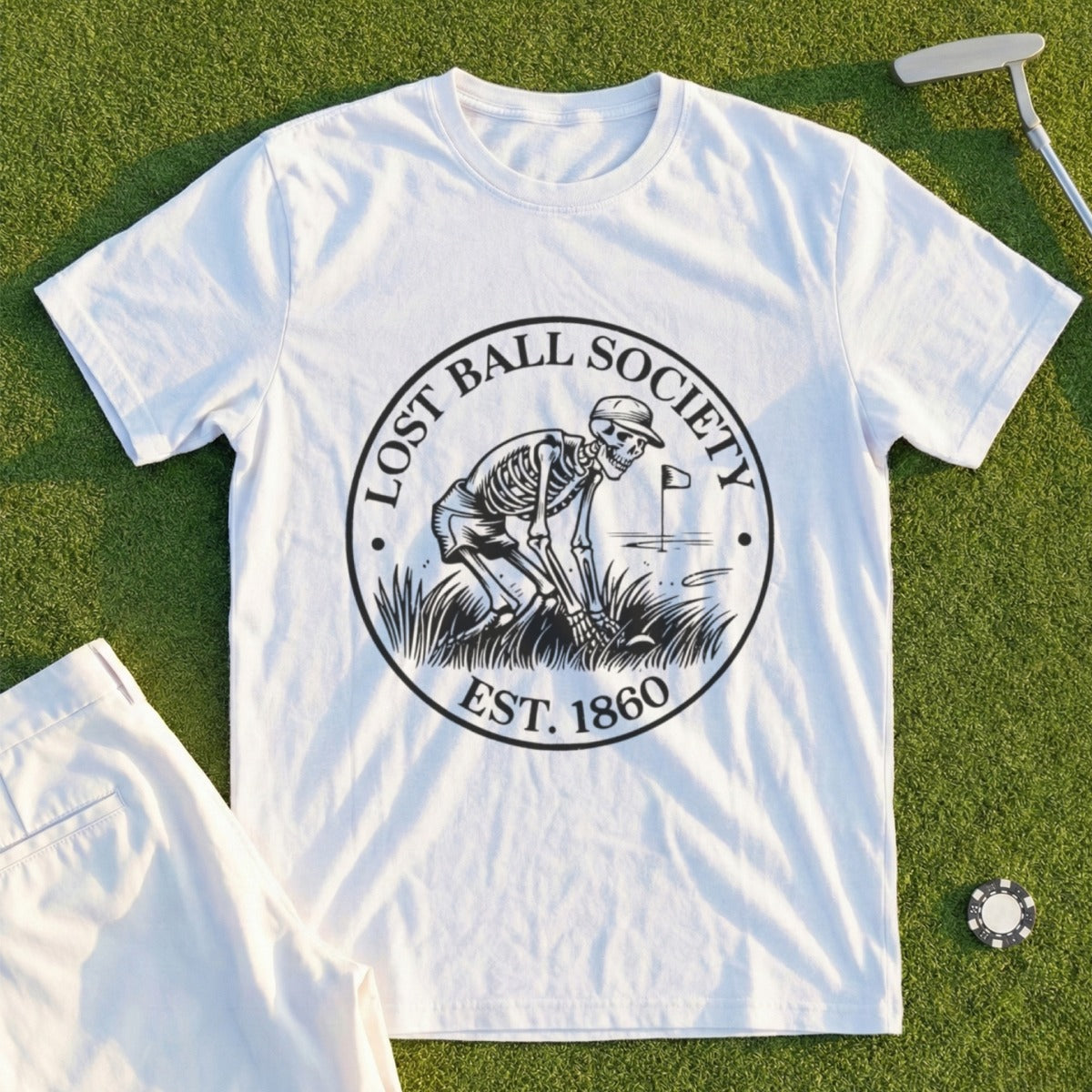 White t-shirt with "Lost Ball Society Est. 1860" and skeleton golfing graphic.