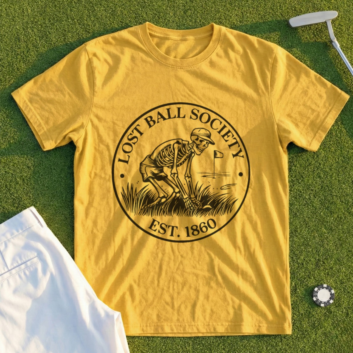 Yellow t-shirt with skeleton golfer graphic, "Lost Ball Society Est. 1860".