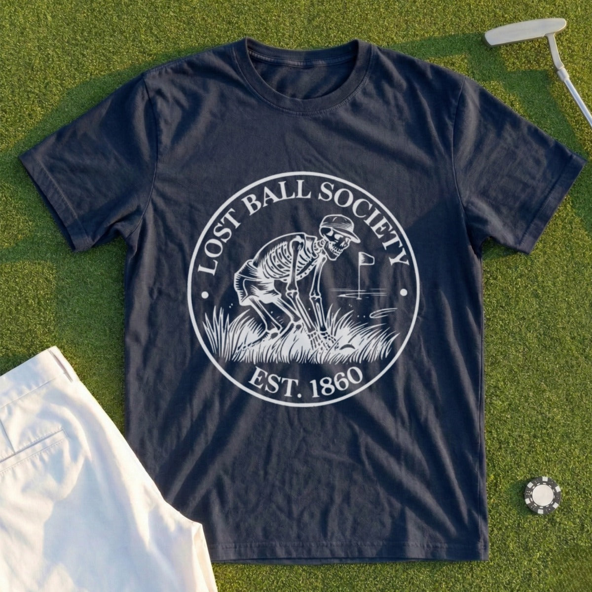 Navy t-shirt with "Lost Ball Society Est. 1860" and skeleton golfer graphic.