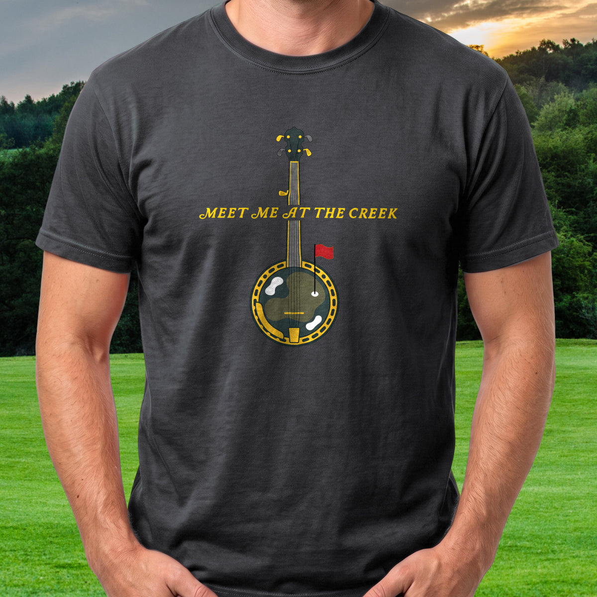 Meet Me At The Creek Banjo Tee worn on the golf course, Black