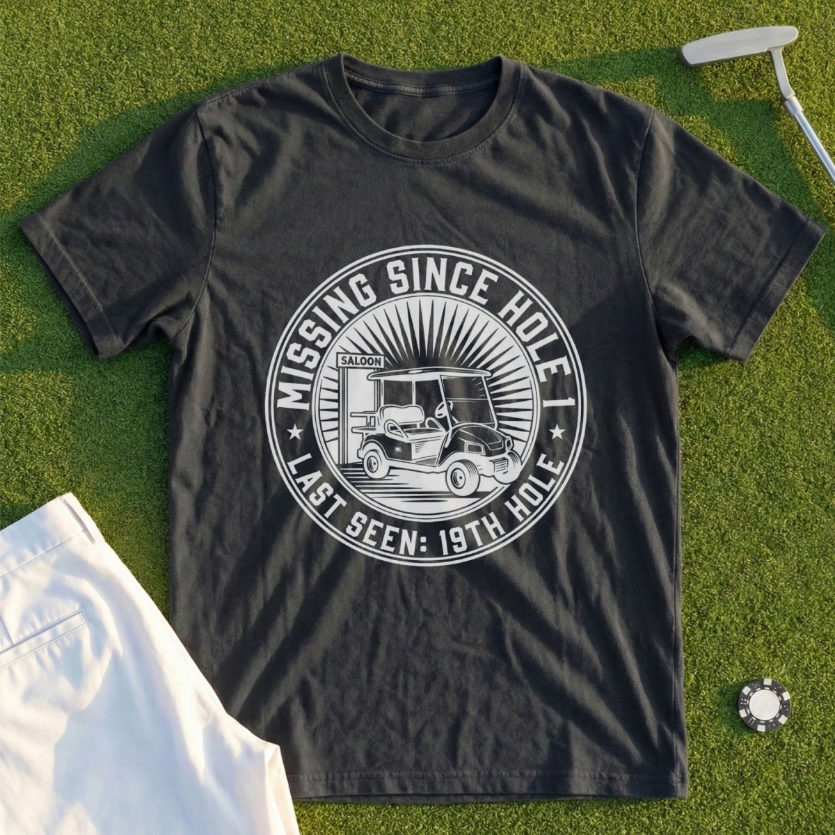 Dark t-shirt with "Missing Since Last Seen: 19th Hole Saloon" text and golf cart graphic.