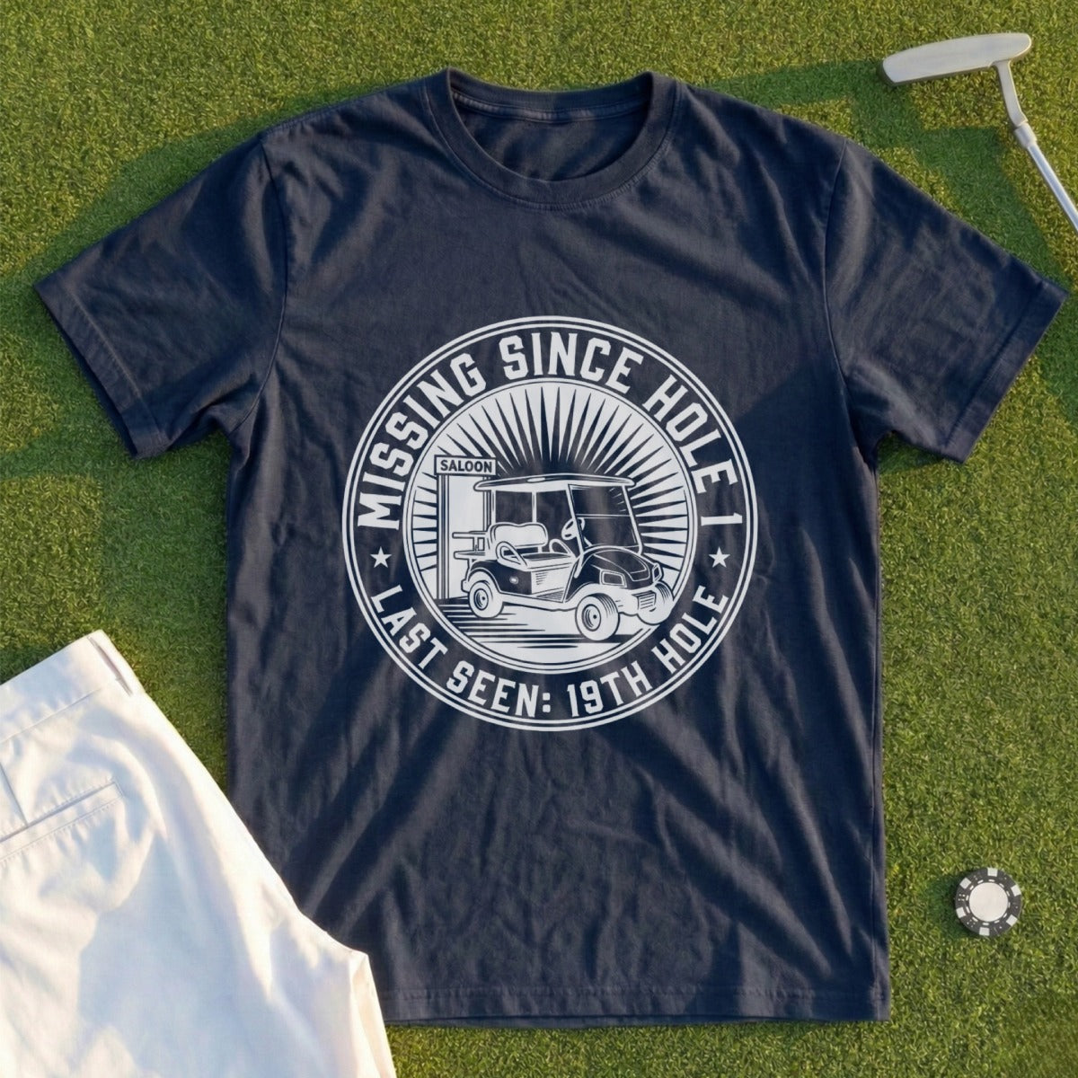 Navy t-shirt with "Missing Since Last Seen: 19th Hole" and golf cart graphic.