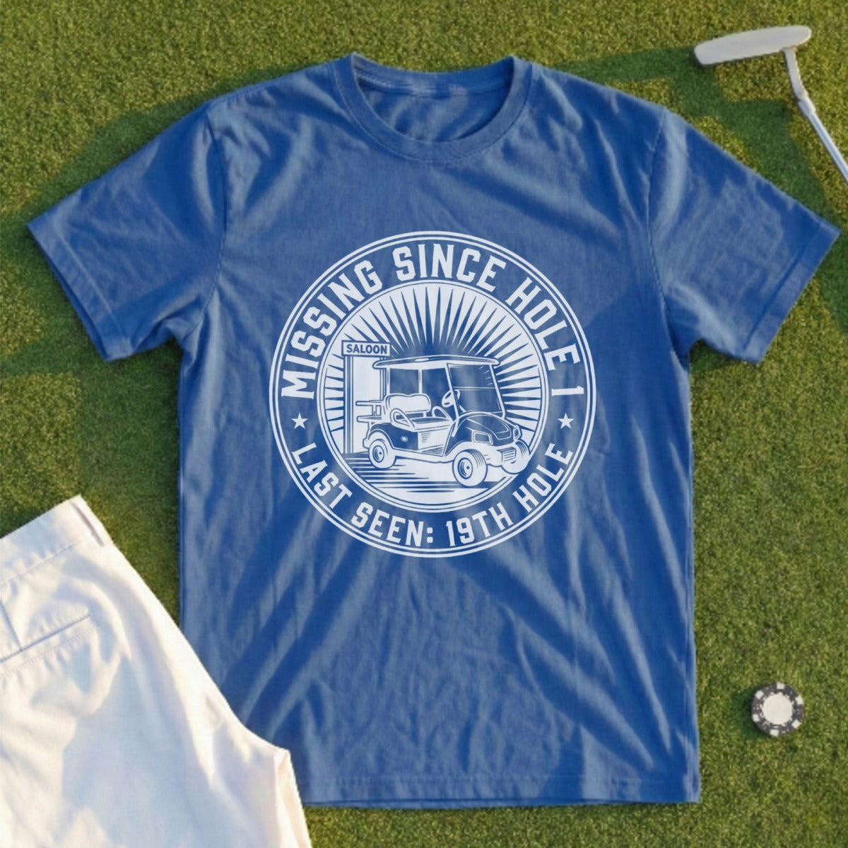 Blue t-shirt with "Missing Since Last Seen: 19th Hole" and golf cart graphic.