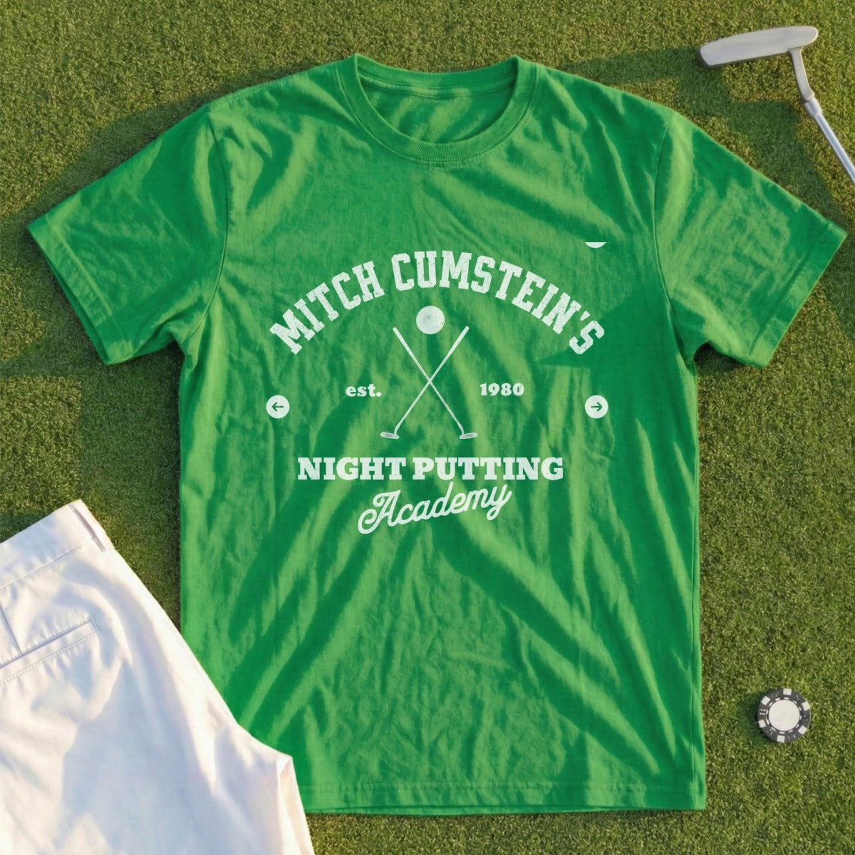 Green t-shirt with "Mitch Cumstein's Night Putting Academy est. 1980" text.