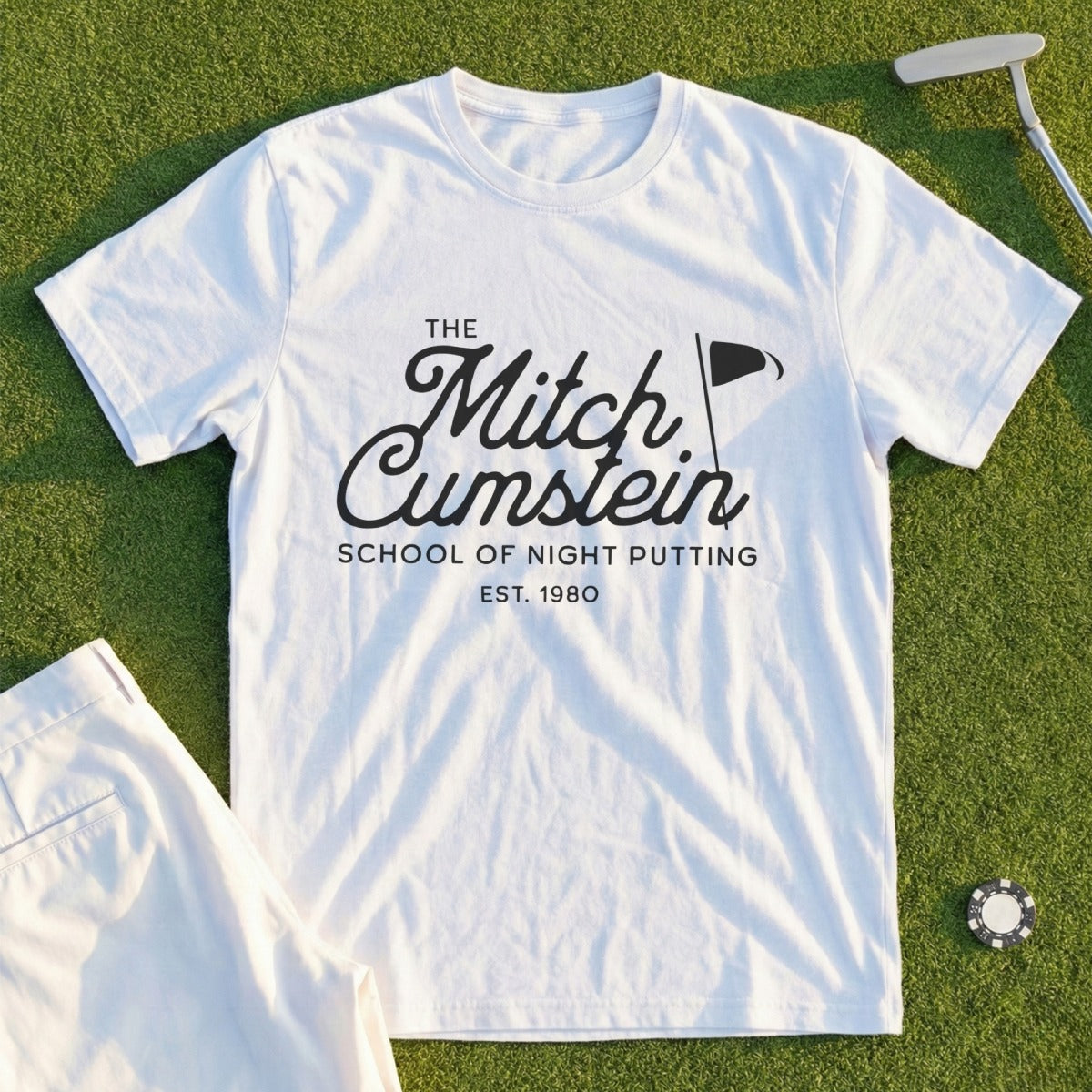 Blue t-shirt with white text: "The Mitch Cumstein School of Night Putting EST. 1980".