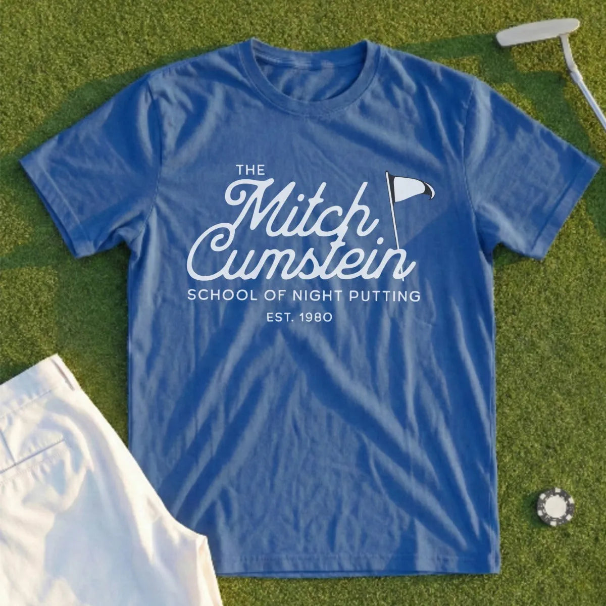 Blue t-shirt with white text: "The Mitch Cumstein School of Night Putting EST. 1980".