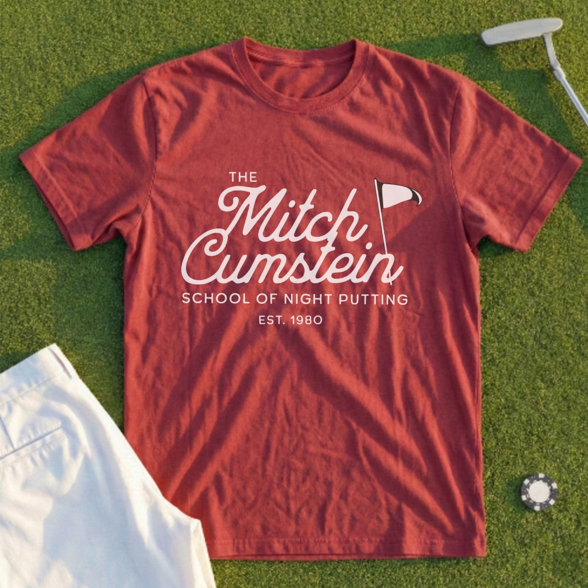 White t-shirt with "The Mitch Cumstein School of Night Putting EST. 1980" logo.