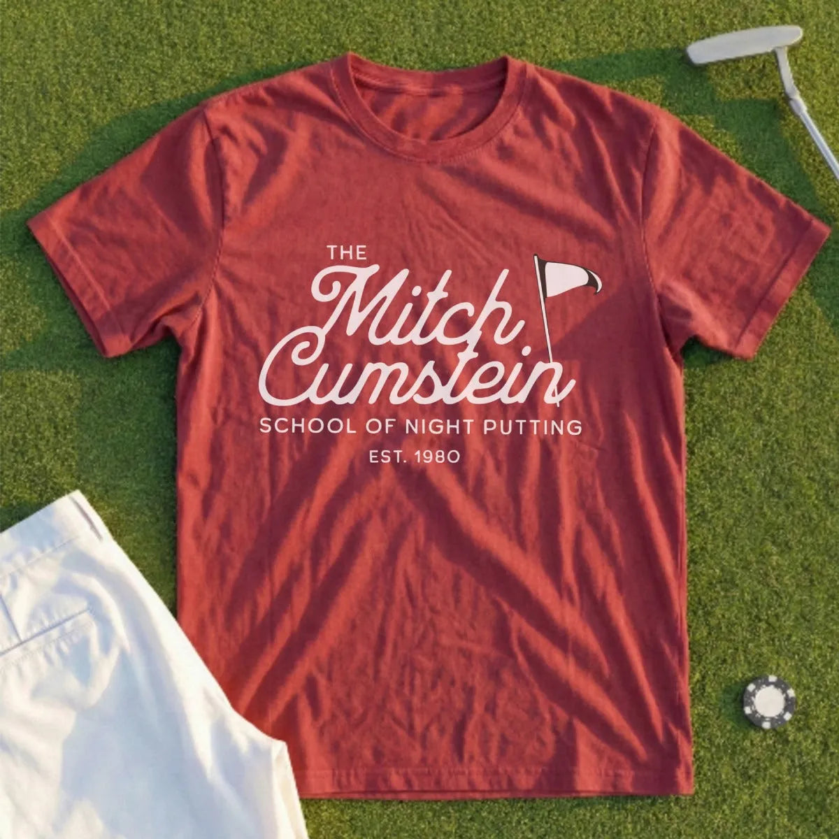Maroon t-shirt with "The Mitch Cumstein School of Night Putting Est. 1980" text.