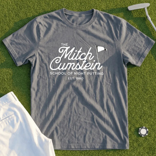 Gray t-shirt with "The Mitch Cumstein School of Night Putting" and flag logo.
