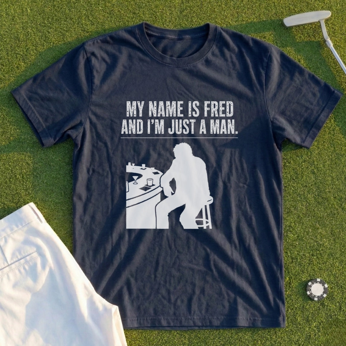 Dark blue t-shirt with white text and silhouette of a man sitting at a bar.