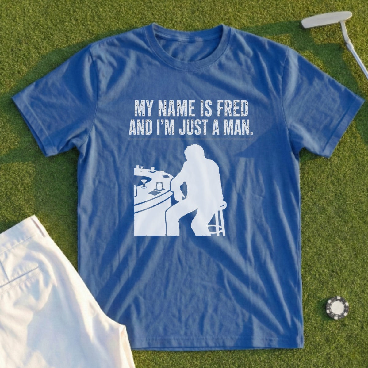 Blue t-shirt with white text and graphic of a man at a bar.