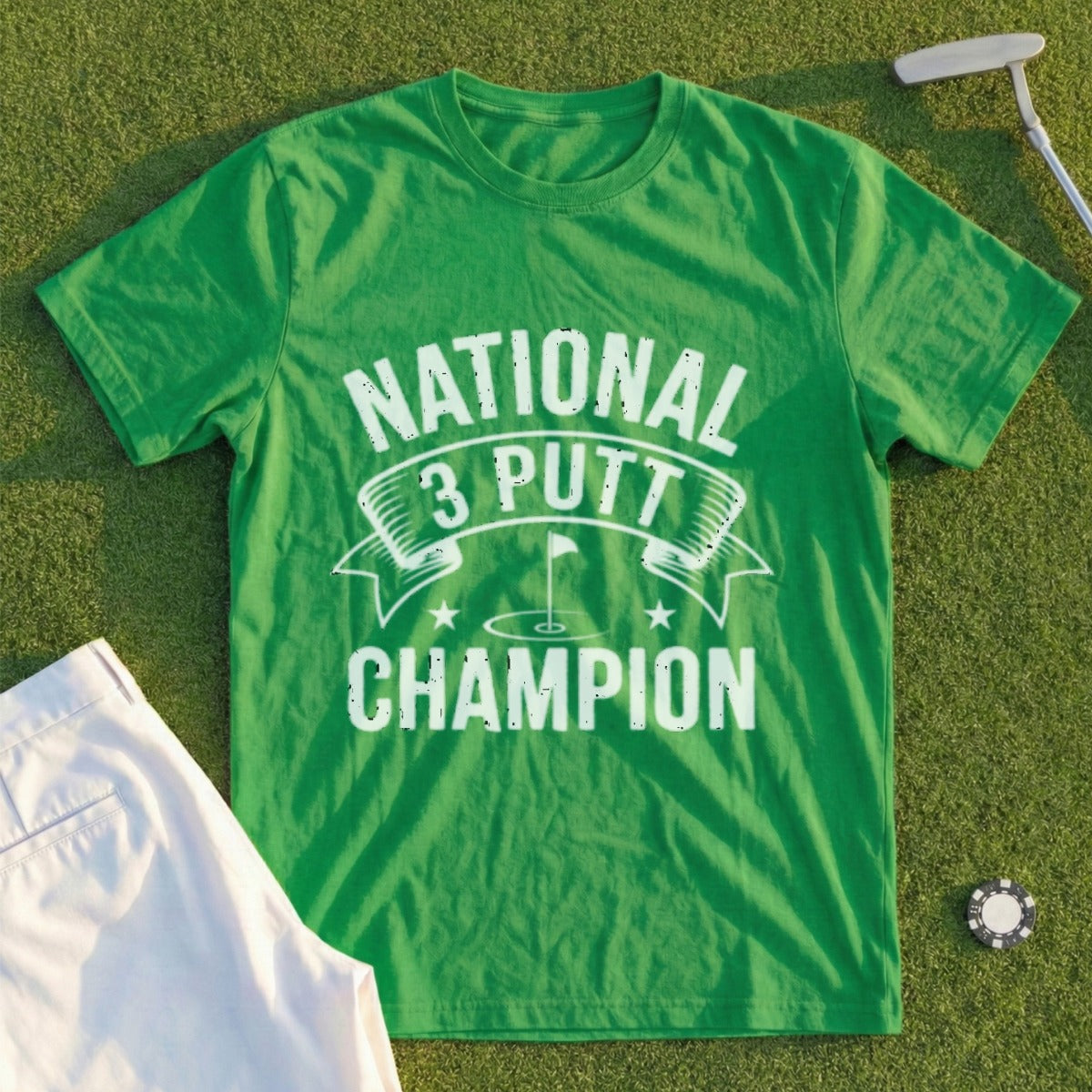 Green t-shirt with "National 3 Putt Champion" text and golf flag graphic.
