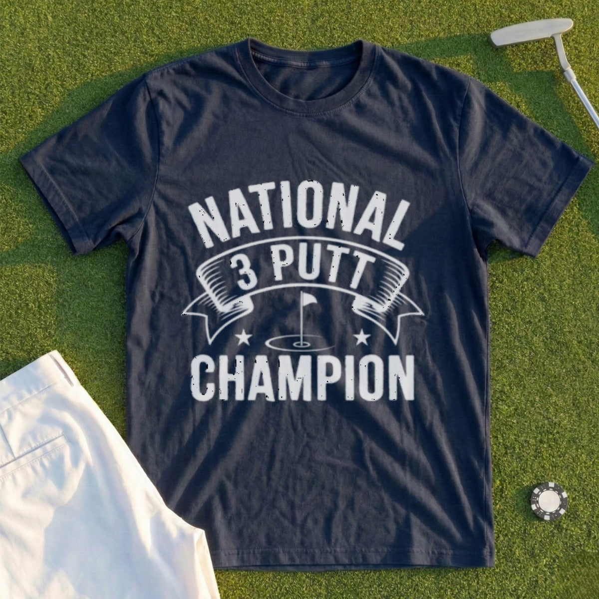 Navy t-shirt with "NATIONAL 3 PUTT CHAMPION" text and golf flag graphic.