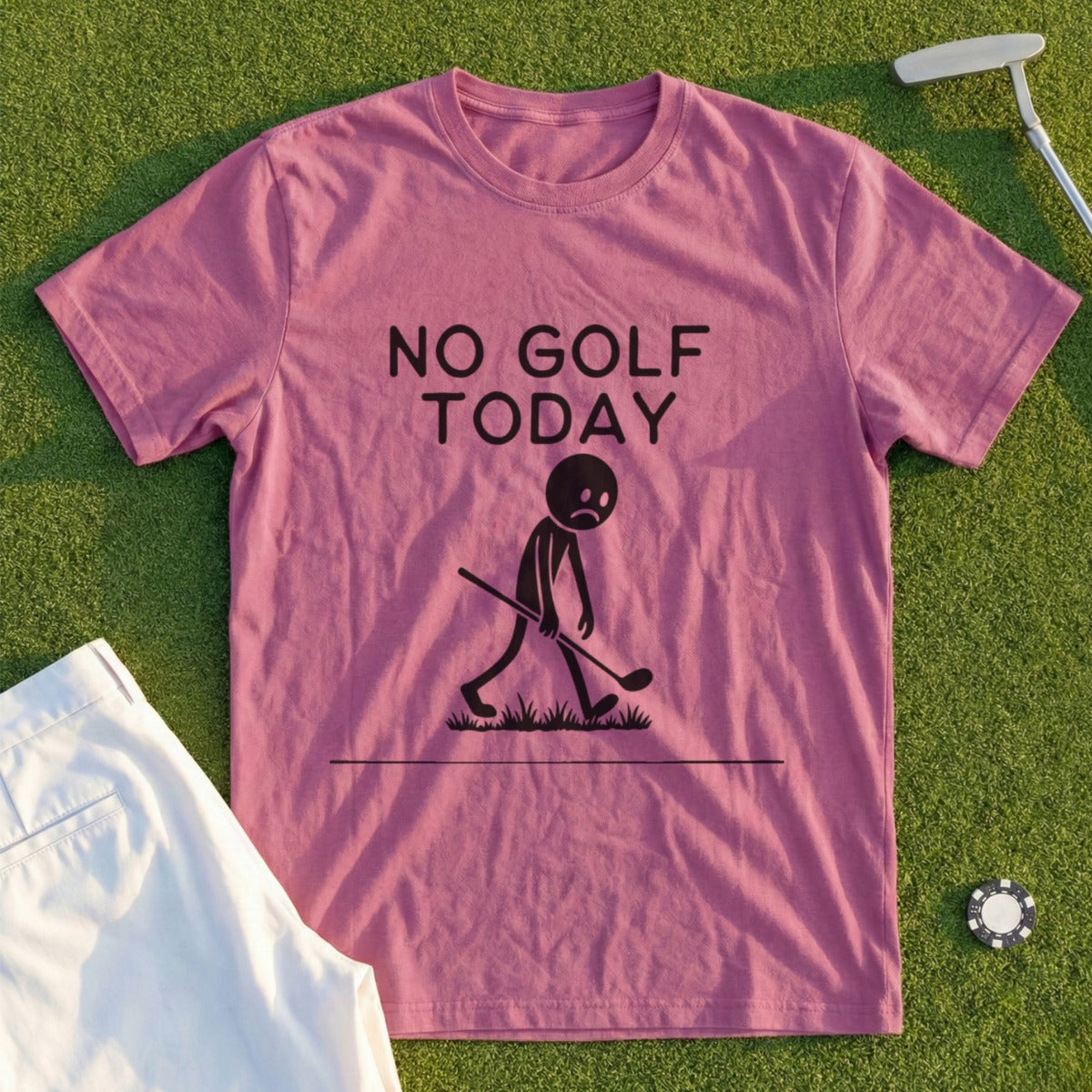 Pink t-shirt with black text and graphic of a sad stick figure with a golf club.