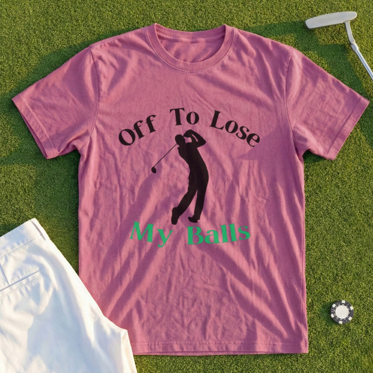 Mauve t-shirt with graphic of golfer and text "Off To Lose My Balls."
