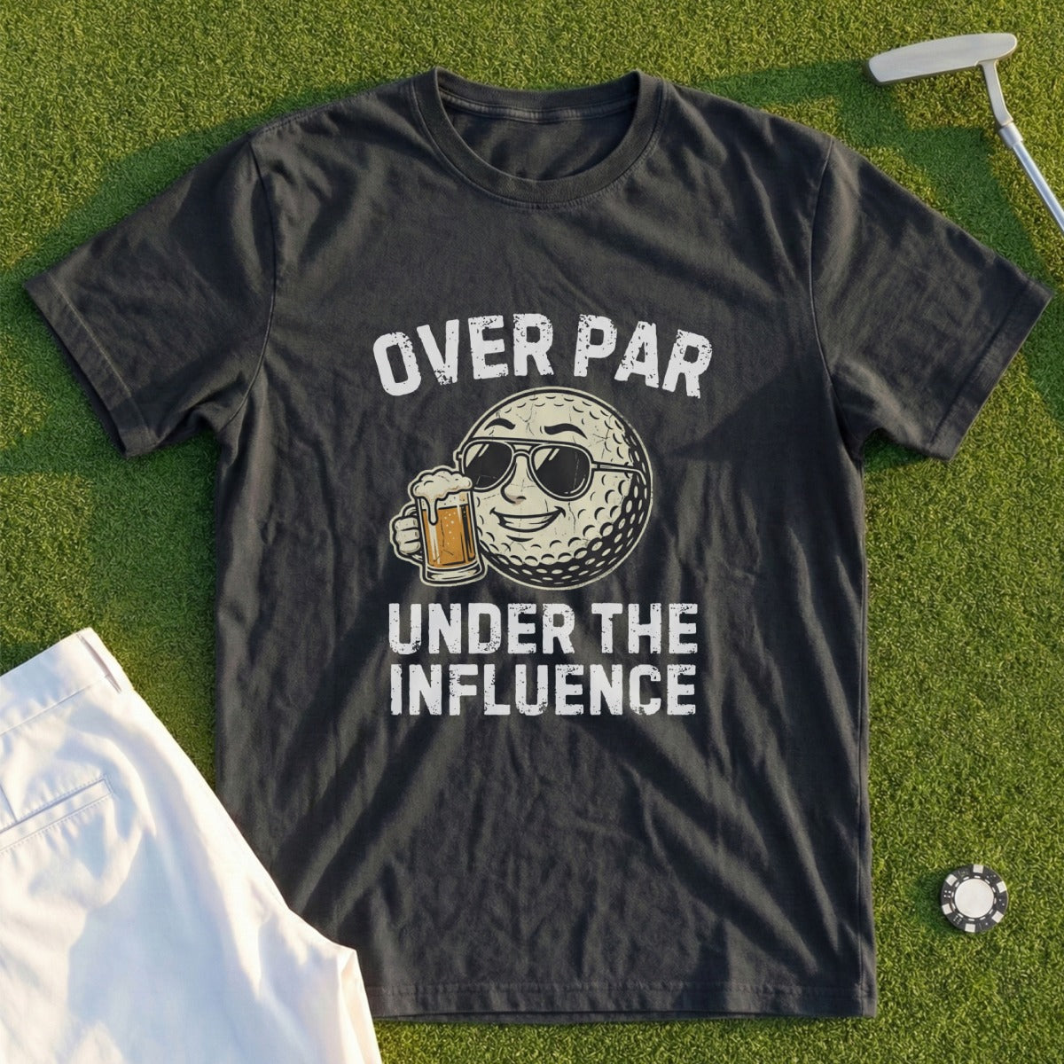 Dark t-shirt with graphic of a sunglasses-wearing golf ball holding beer, "OVER PAR UNDER THE INFLUENCE".