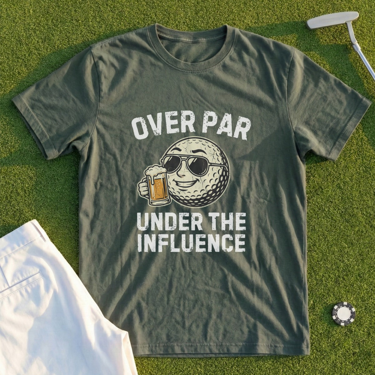 Olive green t-shirt with "Over Par Under the Influence" and cartoon golf ball wearing sunglasses.