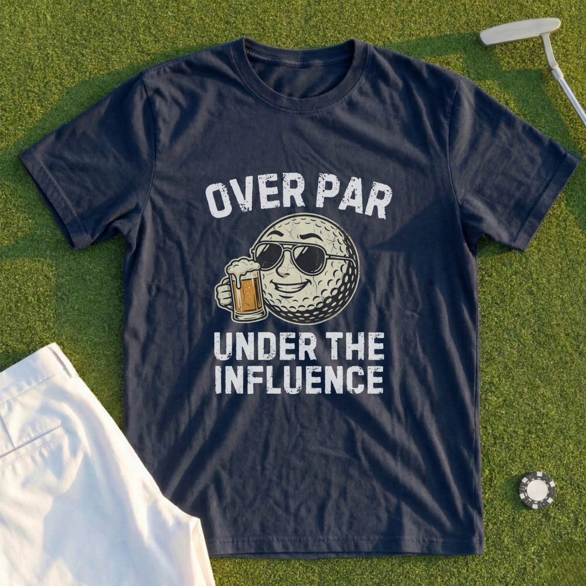 Navy t-shirt with a golf ball wearing sunglasses and holding a beer, text reads "OVER PAR UNDER THE INFLUENCE".