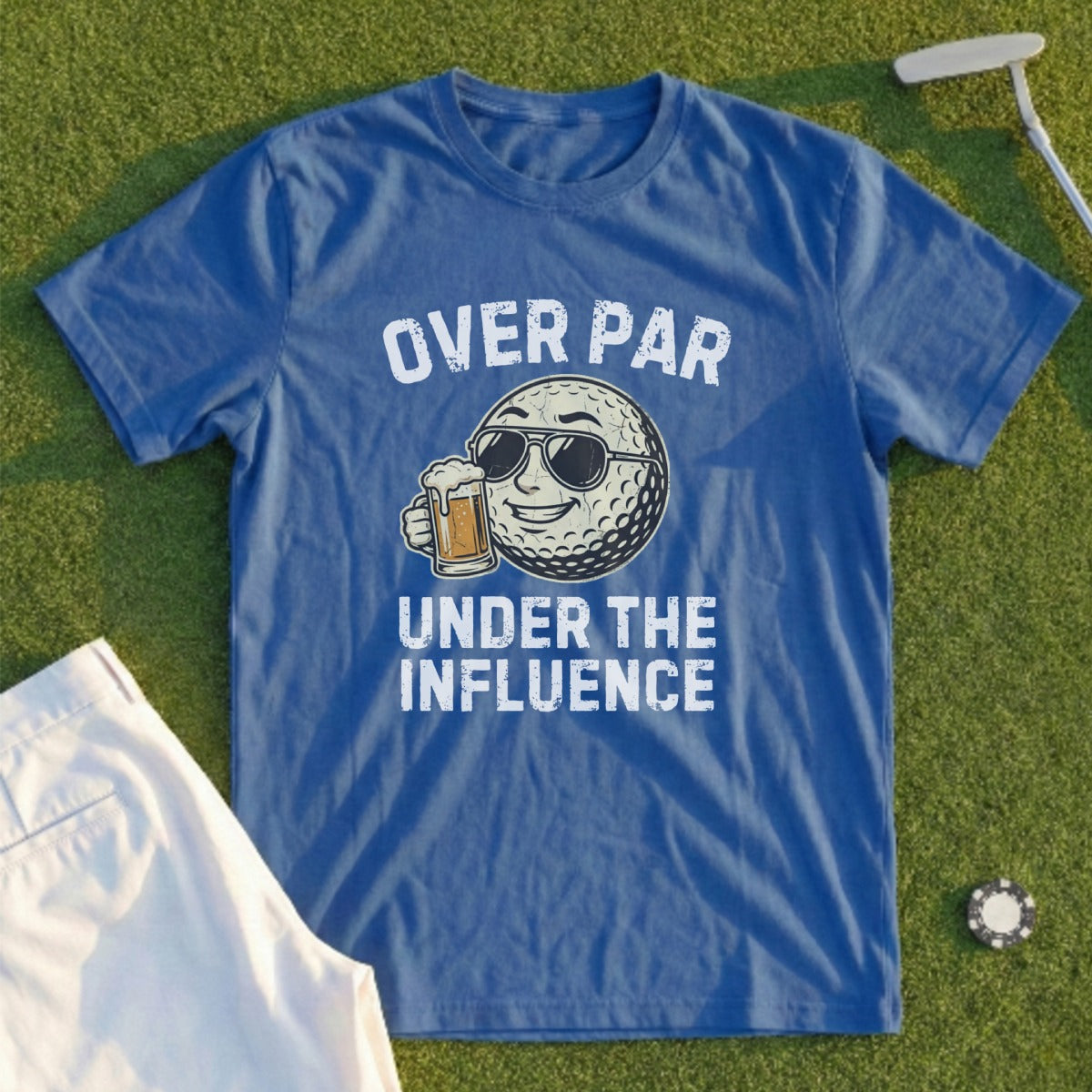 Blue t-shirt with text "Over Par Under The Influence" and a golf ball character.