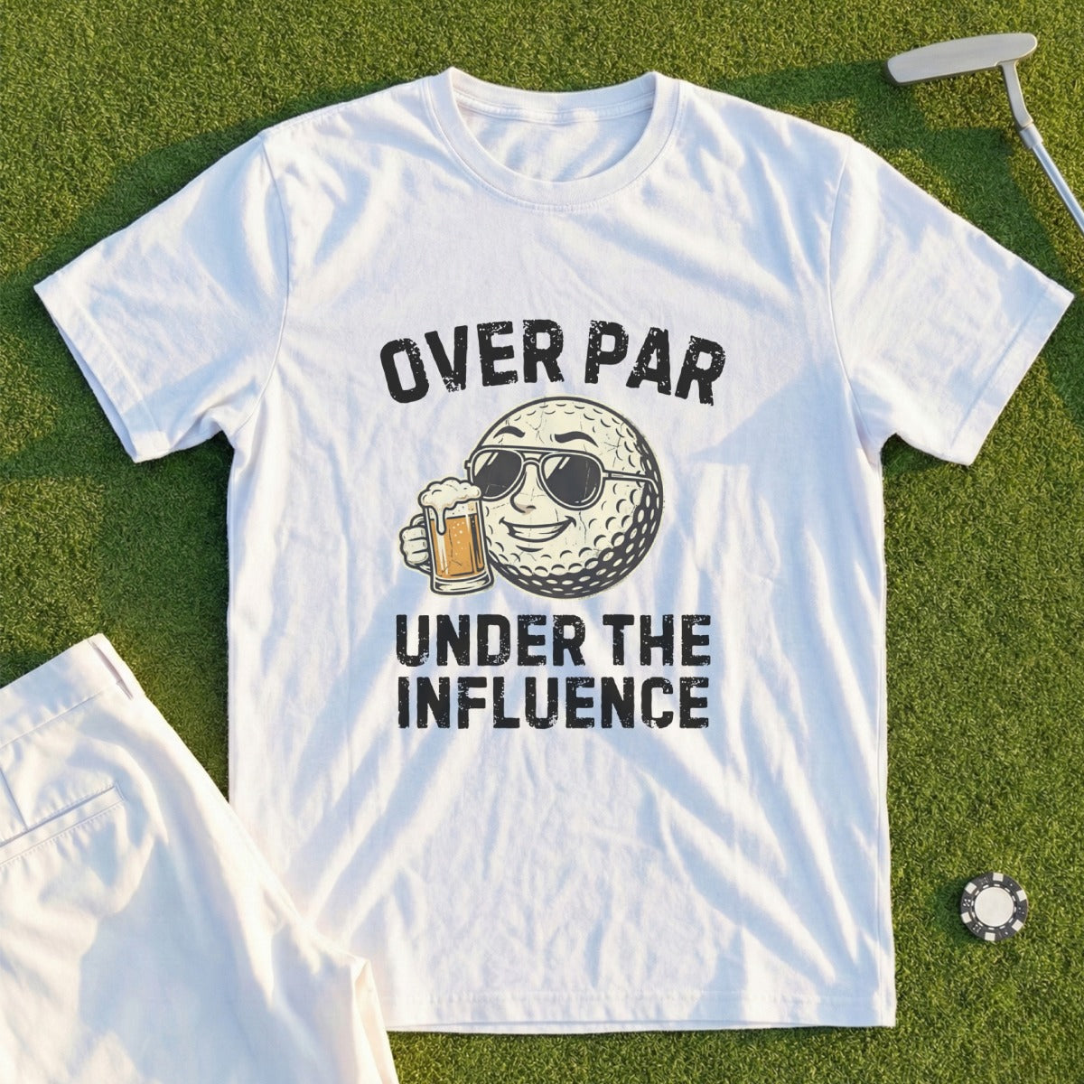 White t-shirt with "OVER PAR UNDER THE INFLUENCE" and a golf ball with sunglasses holding a beer.