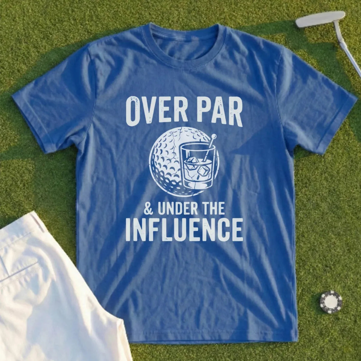 Blue t-shirt with "OVER PAR & UNDER THE INFLUENCE" and golf ball with drink graphic.