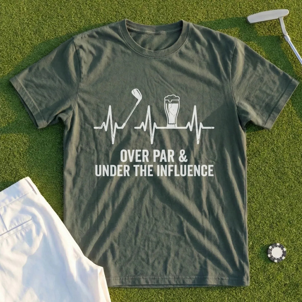Olive green t-shirt with golf club, beer, and heartbeat graphic and text.