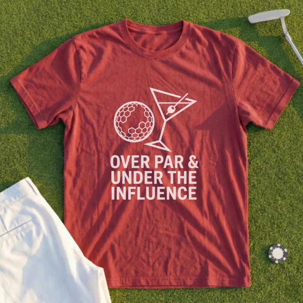 Maroon t-shirt with text "OVER PAR & UNDER THE INFLUENCE" and golf ball martini graphic.