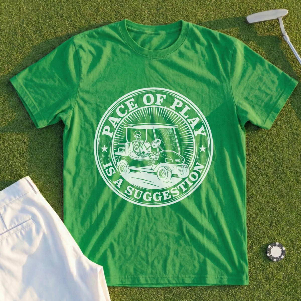 Green t-shirt with a skeleton driving a golf cart and "Pace of Play is a Suggestion" text.