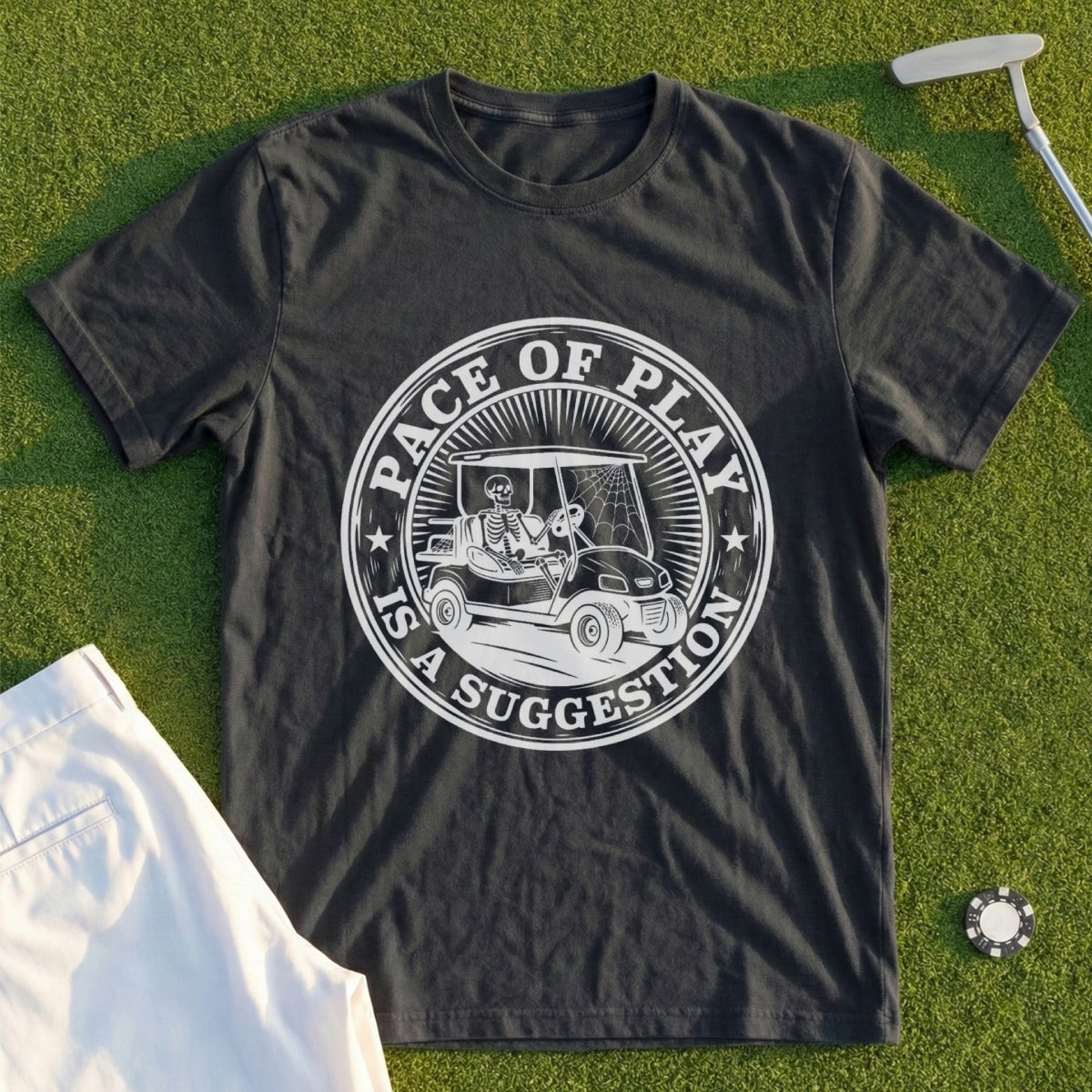 Dark t-shirt with circular graphic: "Pace of Play Is a Suggestion" and skeleton in golf cart.