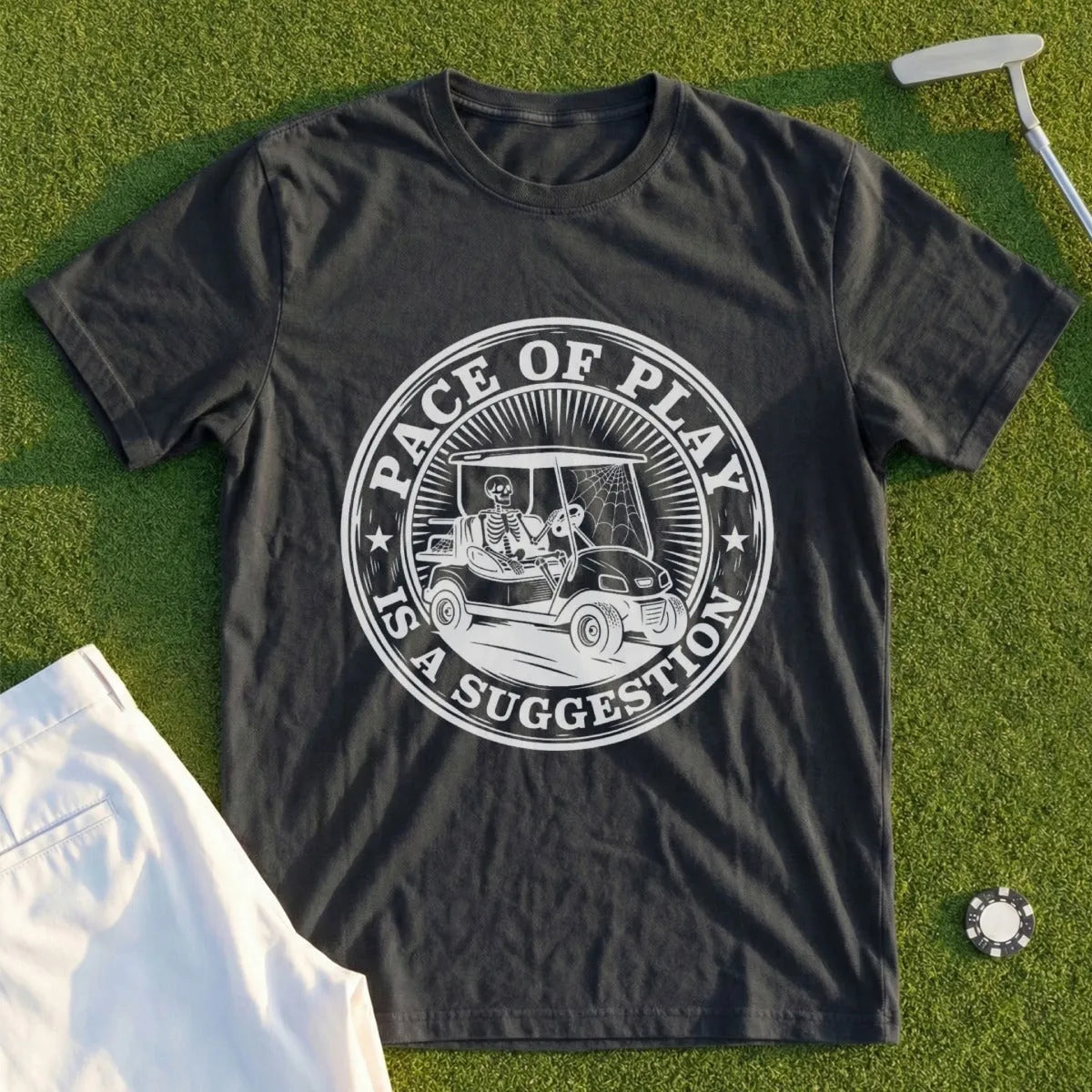 Dark t-shirt with circular graphic: "Pace of Play Is a Suggestion" and skeleton in golf cart.