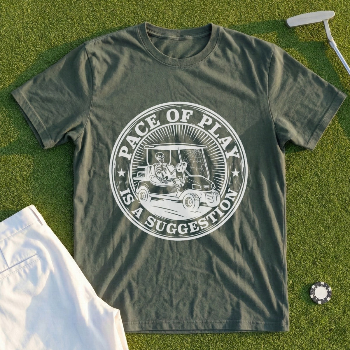 Olive green t-shirt with skeleton in golf cart graphic and "Pace of Play is a Suggestion" text.