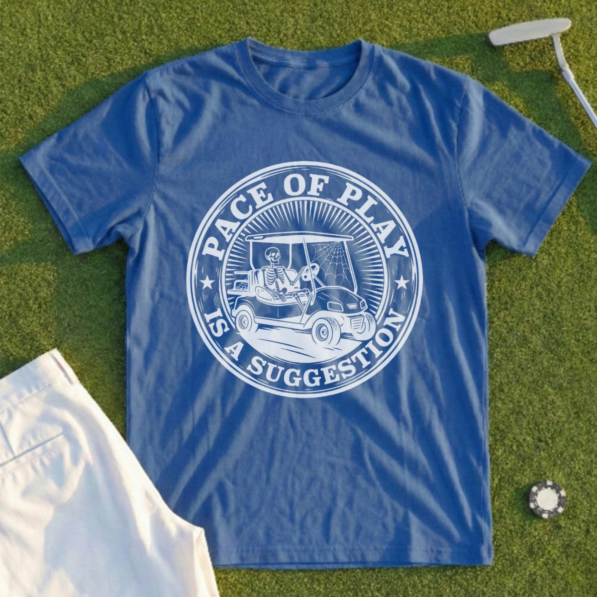 Blue t-shirt with a skeleton golfer in a cart graphic and "Pace of Play is a Suggestion" text.