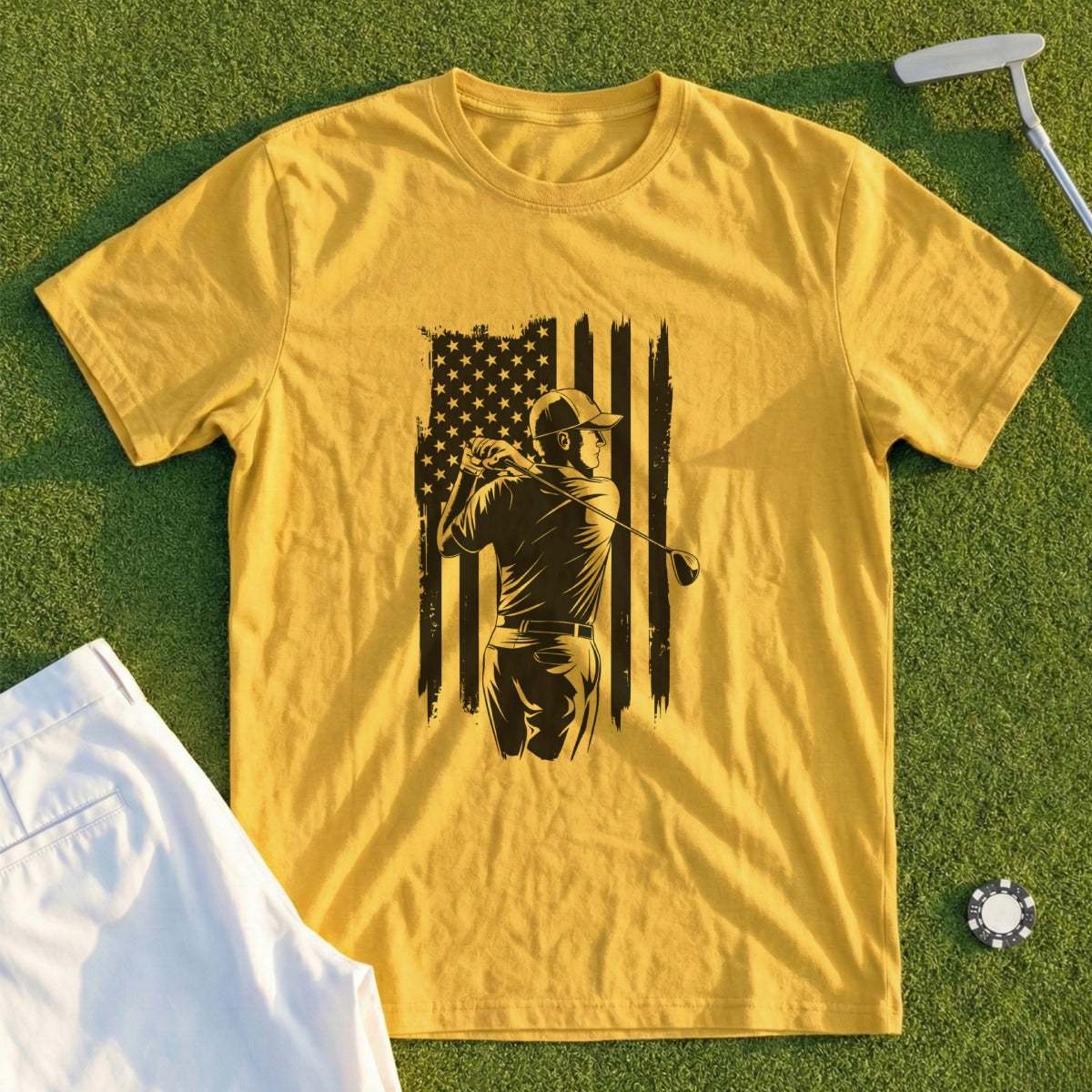 Golfer silhouetted against distressed American flag on yellow t-shirt.