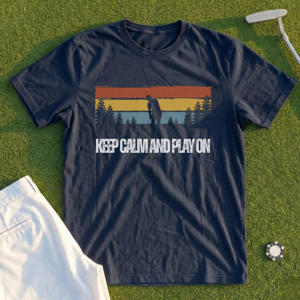 Navy t-shirt with a golfer silhouetted against a sunset and the text "KEEP CALM AND PLAY ON".